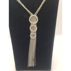 a multi-strand rhinestone tassel necklace with three circular rhinestone accents
